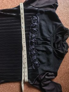 Elegant black pleated top.