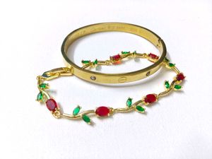Elegant Gold Bracelet with Red & Green Stones