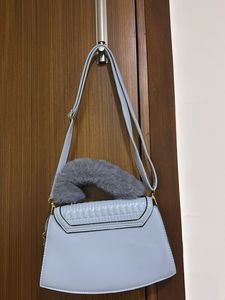 :Elegant blue Quilted Sling Bag with Faux Fur Hand