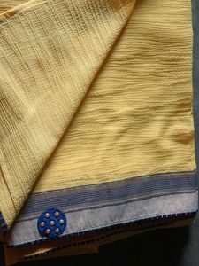 Vibrant Yellow Saree with Blue Embellishments