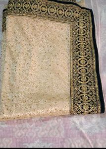 Elegant Beige Embroidered Saree