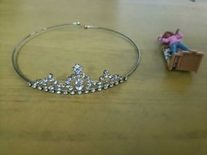 Sparkling crown and artist barbie figurine