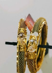 Brand new Elegant Gold Bangles with Red Stones