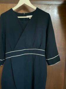 Elegant Black Wrap Dress with White Trim