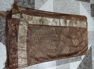 Elegant Brown Saree with Leaf Motif
