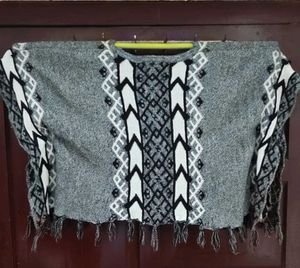 Cozy Knit Poncho with Tassels