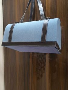 Stylish Blue Handbag with Brown Trim