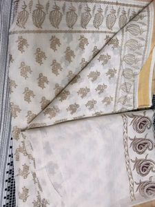 Elegant Cream Saree with Paisley Border