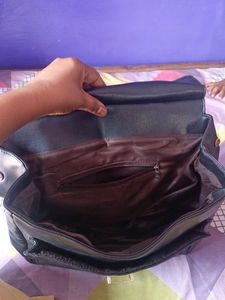 black handbag cum backpack style bag.