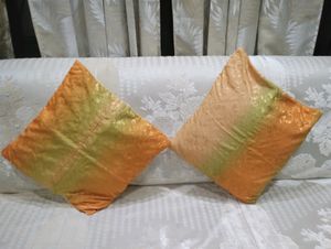 A set of two cushion covers