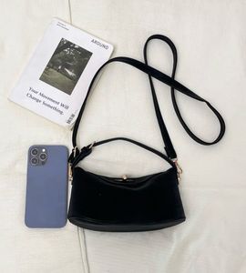 Chic Black Shoulder Bag with Gold Hardware