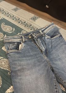 Distressed Blue Denim Jeans