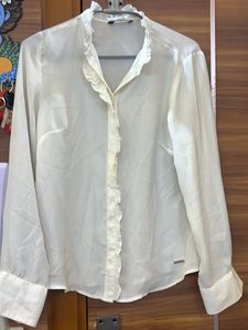 Elegant Cream Top with Metal Detail