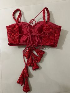 red backless blouse