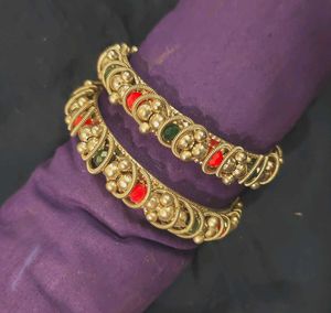 Silver tone Bangles: Red and green details.