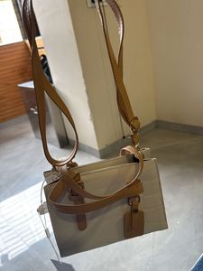 Stylish Beige Handbag with Brown Accents