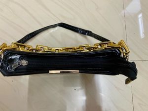 Chic Black Patent Handbag with Gold Chain