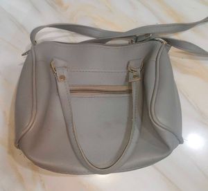 Grey sling bag