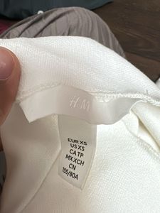 White Sleeveless Vest with Gold Buttons