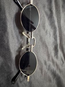 voyage black oval unisex sunglasses
