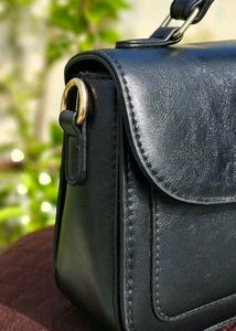 Chic Black Handbag with Embellished Detail