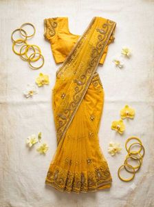 Stunning Yellow Embroidered Kundan Saree