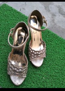 Golden colour beautiful heel