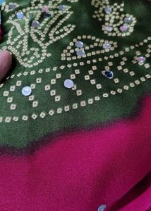 megenta Bandhani Saree with mehndi Border