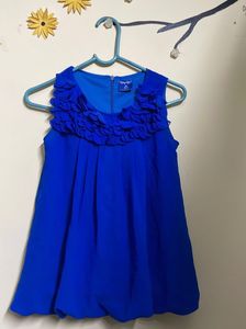 sleeveless blue top