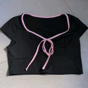 Cute black crop top with pink trim