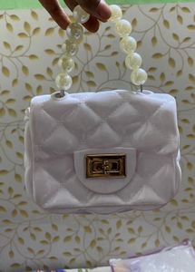 Chic White Quilted Pearl Handle Clutch