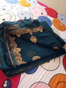 Beautiful Teal Saree with Gold Border