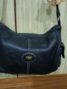 Chic Navy Leather Shoulder Bag with Flower Accent