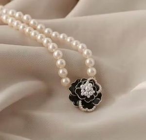 Elegant Pearl Necklace with Flower Pendant