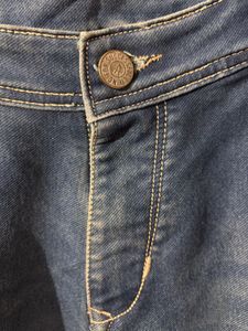 Distressed Blue Denim Jeans