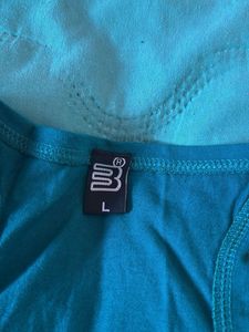 Teal-green racerback tank top.