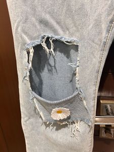 Ripped Wide Leg Jeans with Daisy Patch
