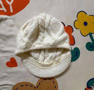 creamy-white knit,  textured cable pattern