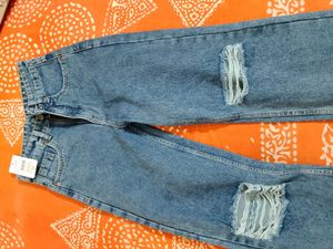 Distressed Blue Denim Jeans