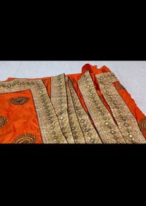 Vibrant Orange Embellished Lehenga Choli