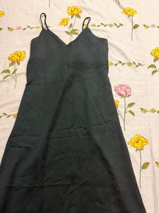 Elegant Black Dress with Floral Accent