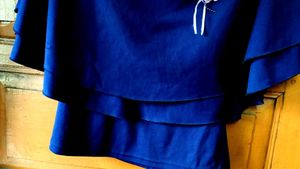 Elegant Navy Blue Tiered Blouse with Flower Accent