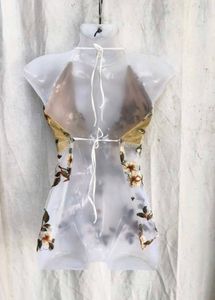 69. Floral Embroidered Sheer Halter Top