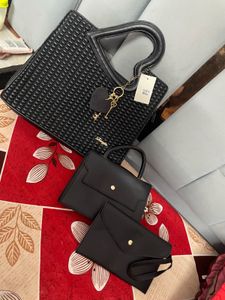 Stylish Black Handbag with Heart Handle