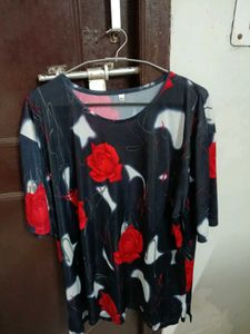 smart black top with red flowers on it