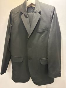 A Raymond Suit of rich dark greenish black colour