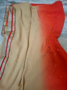 Vibrant Orange Saree with Pearl Embellishments