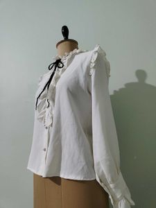 Ruffled White Blouse with Black Bow