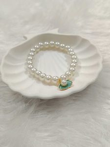 Elegant Pearl Bracelet with Shell Charm