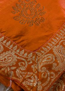 Stunning Orange Saree with Gold Border